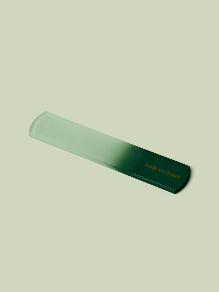 Ombre green glass foot file by Kate McLeod on light green background,