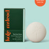 Kate Mcleod Foot Stone and packaging on a light teal background