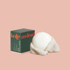 Kate McLeod packaging of the Mama Stone on a pink background.