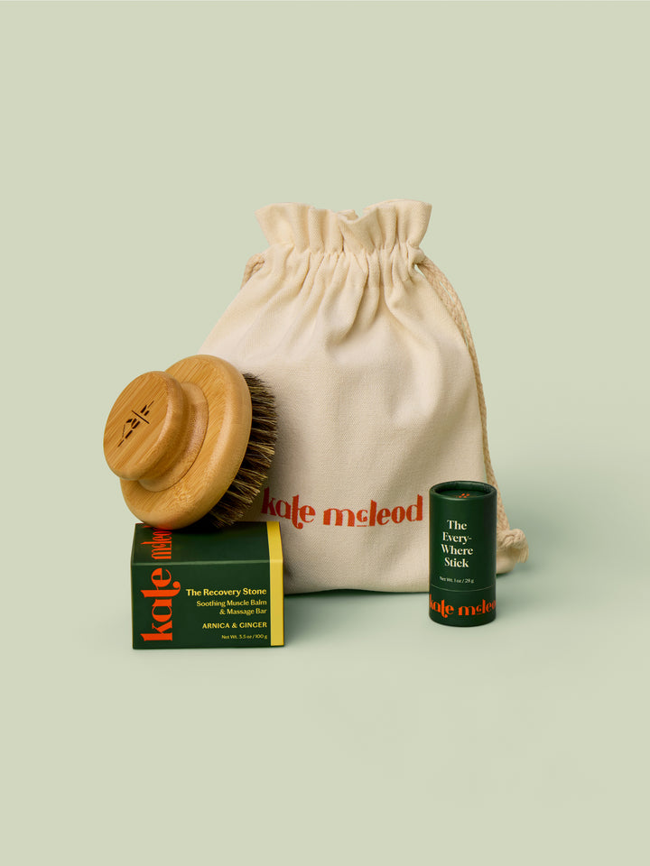 The Gift Bag pictured with Dry Brush, Recovery Stone, and Everywhere Stick to demonstrate size. These products would all fit into the bag.