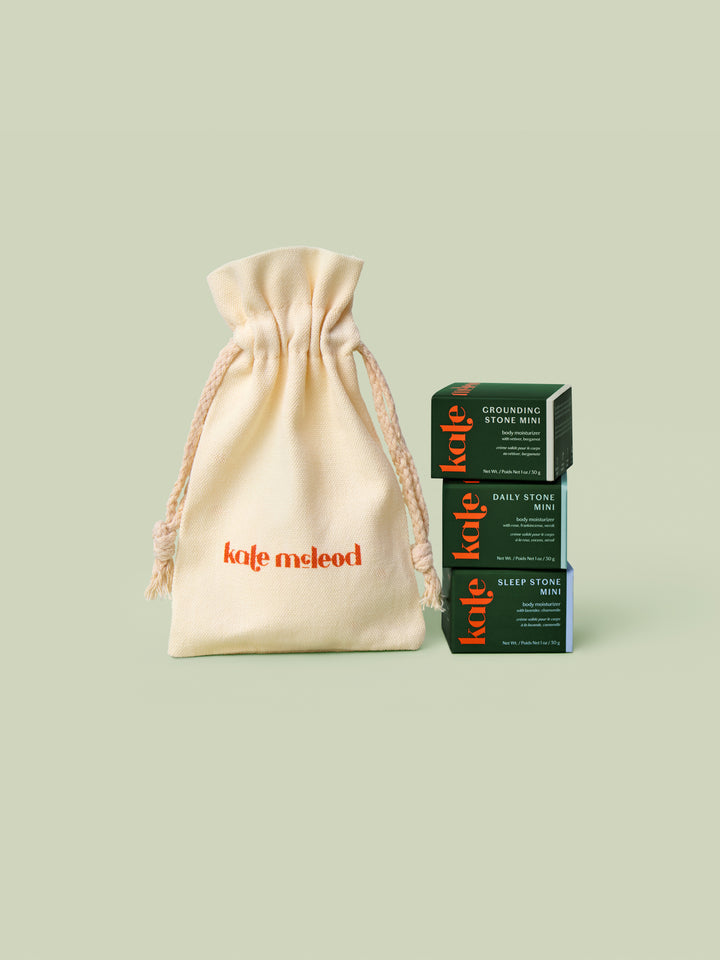 The Kate McLeod Gift Bag styled alongside three mini stones in green boxes on a light green background.