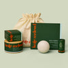 Display of what can fit inside the large gift bag. A Body Stone Refill, a Body Stone Starter Kit, Pebble box, Mini Travel Case, and Everywhere Stick.