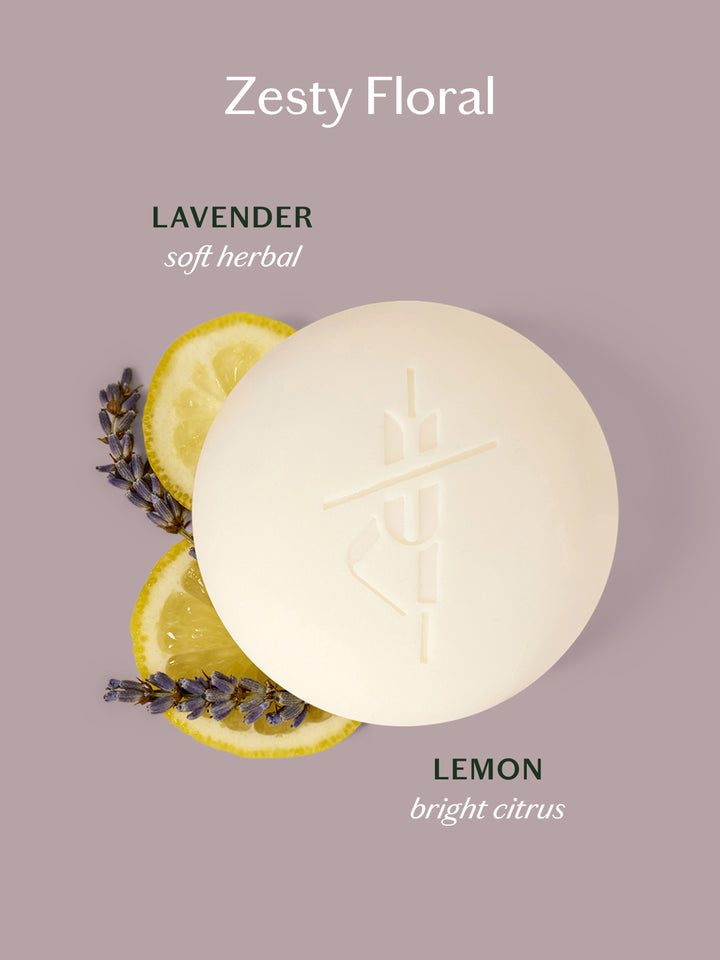 The Lavender Lemonade Body Bar with lemon slices and lavender on a light lavender background