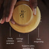 Wooden dry brush with text describing its benefits on a brown background