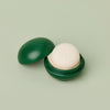 Mini Travel Case in Pine Green with a white mini Body Stone nestled inside.