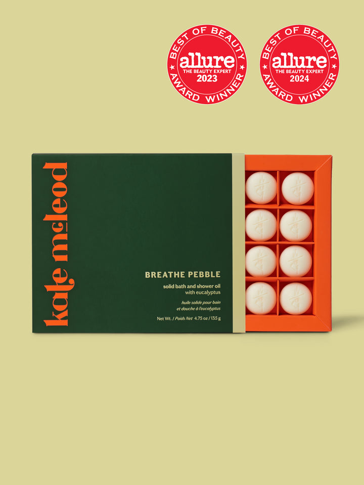 Kate McLeod Breathe Pebble packaging with Allure award logos on a green background