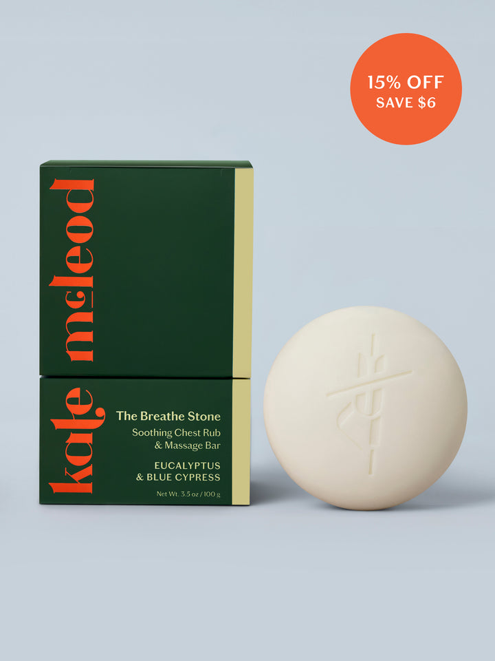 Kate McLeod Breathe Stone lotion bar and packaging on a light blue background