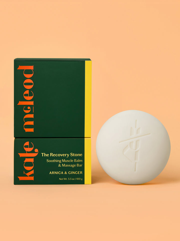 Kale McLeod Recovery Stone lotion bar and packaging on a peach background