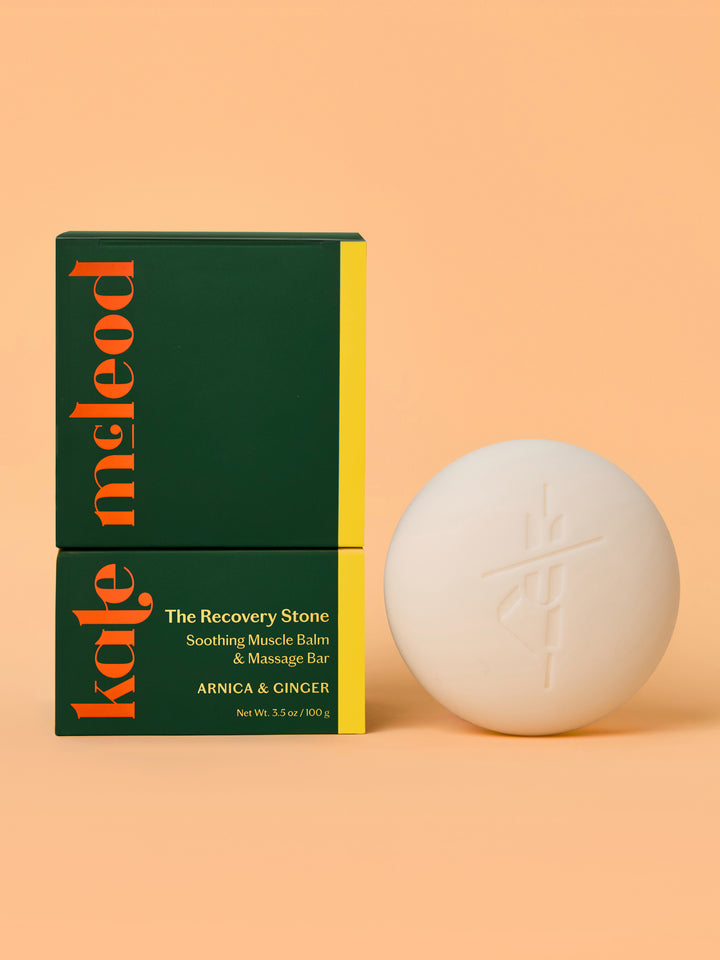 Kale McLeod Recovery Stone lotion bar and packaging on a peach background