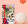 Kate McLeod Nectar Stone with floral butterfly illustrated design packaging against a peach background.