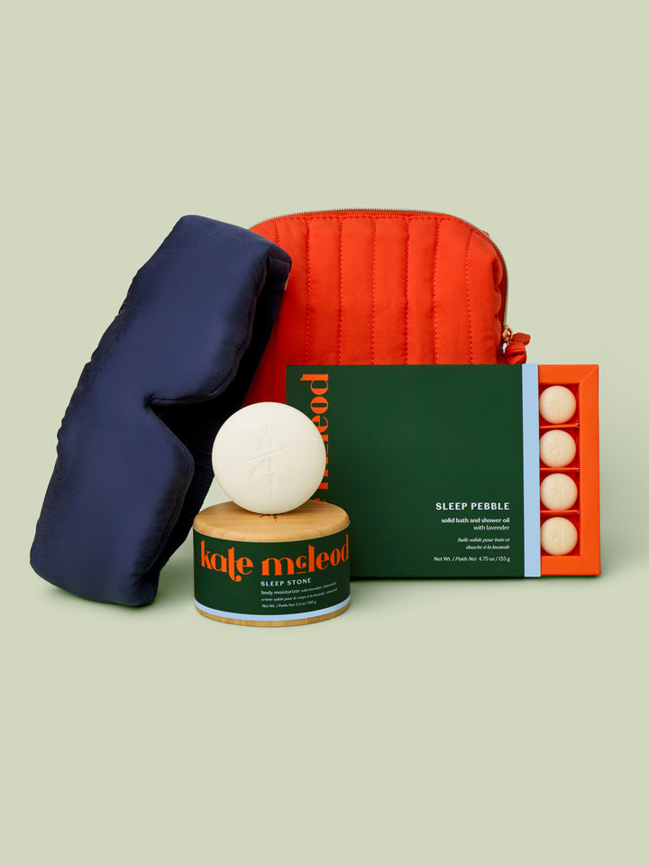Sleep Routine Set against a green background. Includes Lunya Sleep Mask, Sleep Stone Starter Kit, and Sleep Pebble.