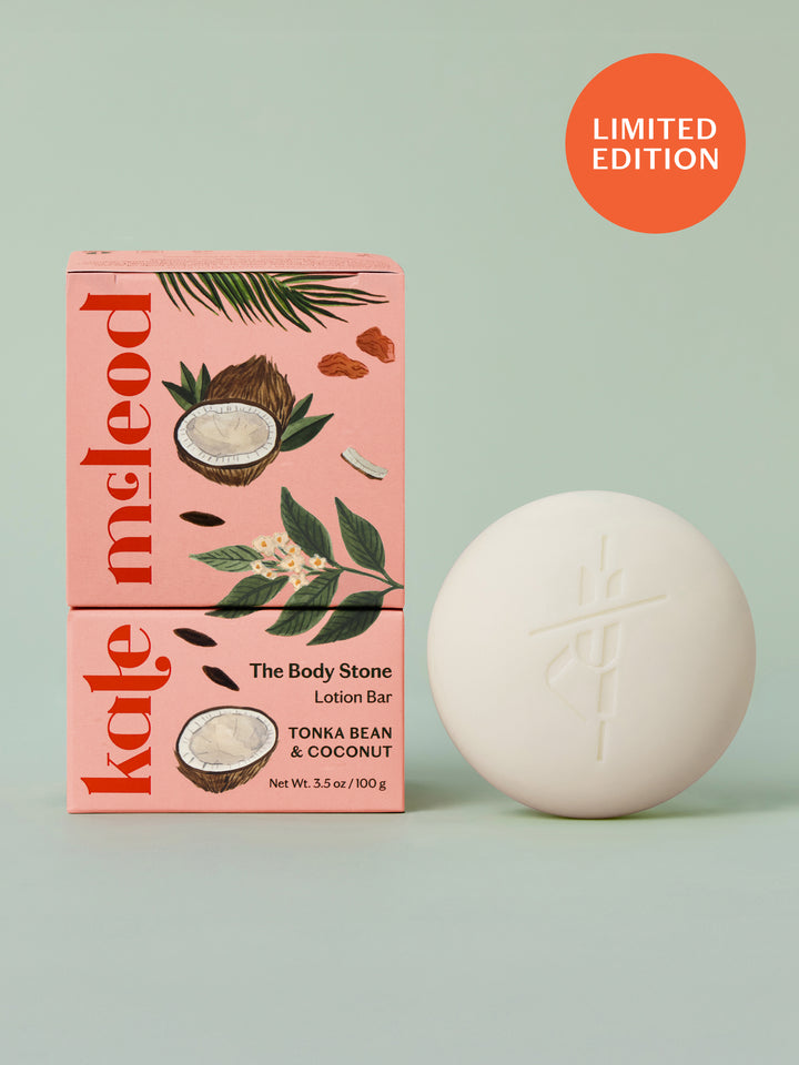 Kate McLeod Tonka Bean & Coconut lotion bar with packaging on a light green background