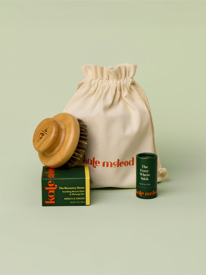 The Gift Bag pictured with Dry Brush, Recovery Stone, and Everywhere Stick to demonstrate size. These products would all fit into the bag.