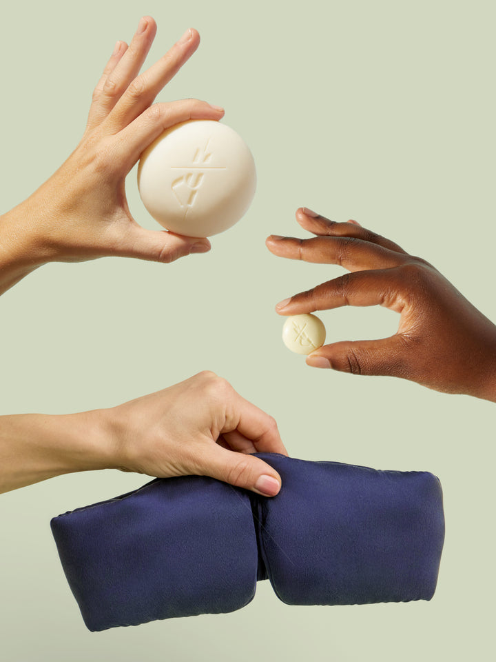 Hands holding up the set components against light green background