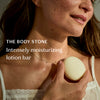 Woman holding a lotion bar with text about intensely moisturizing lotion bar.