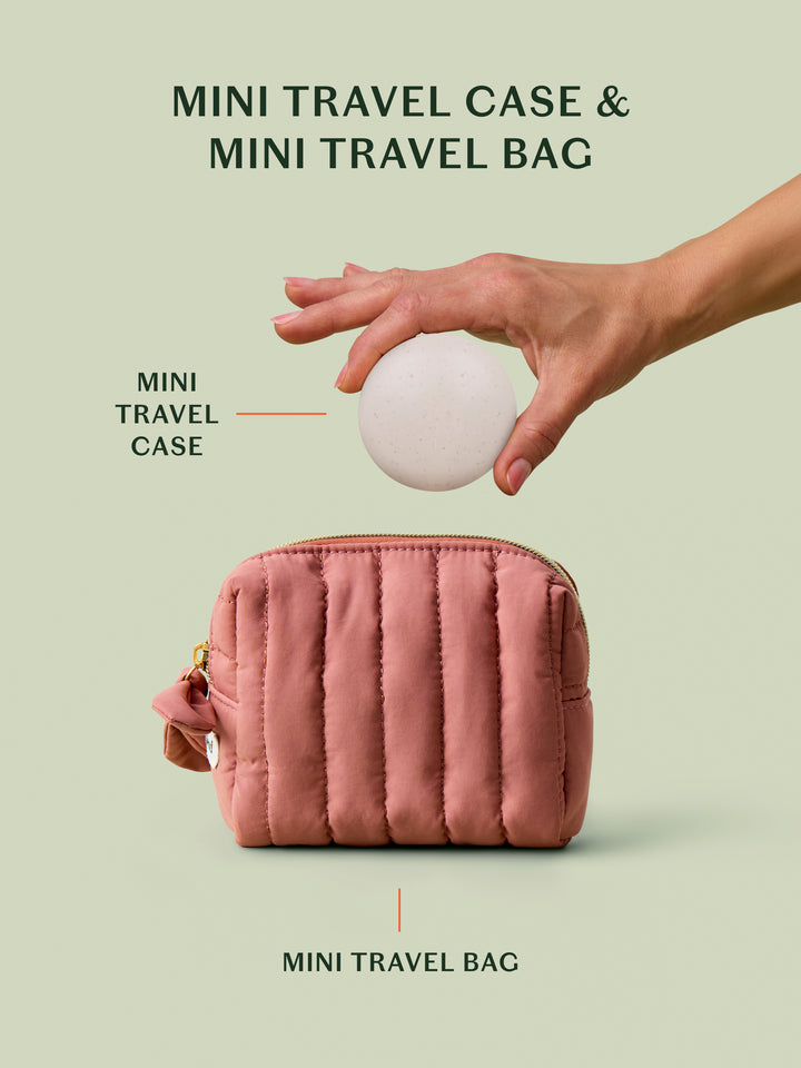 The limited-edition blush travel bag alongside a the mini travel case for a size comparison on a light green background.