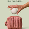 The limited-edition blush travel bag alongside a the mini travel case for a size comparison on a light green background.