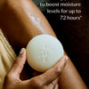 Hand holding a white Body Stone lotion bar against skin with text about clinical claim. Boosts moisture levels for up to 72 hours.
