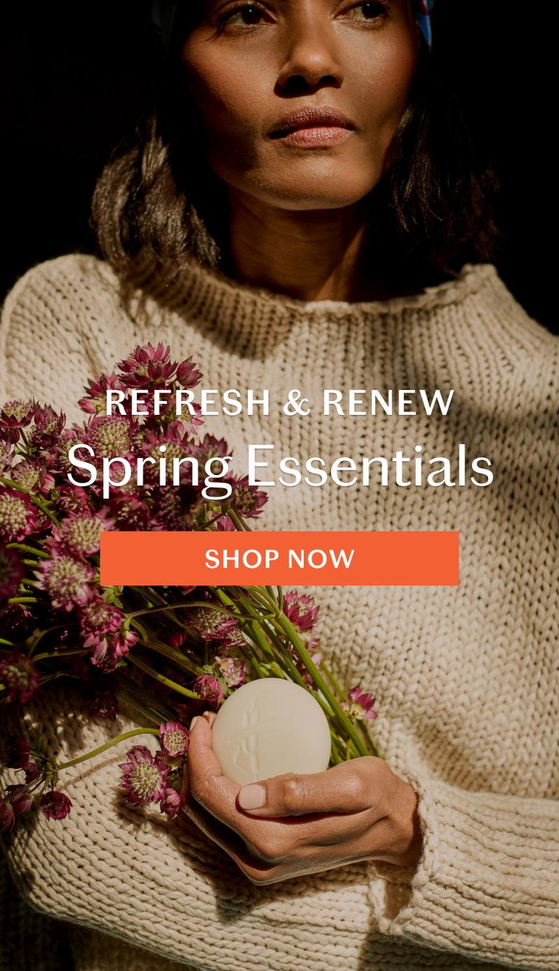 Person holding flowers and a Body Stone with 'Refresh & Renew Spring Essentials' text and 'Shop Now' button. Click to shop Spring Essentials.