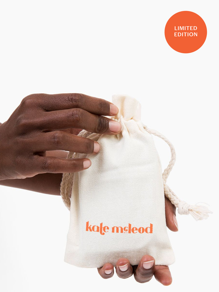Image of Kate McLeod Freshly Batched limited edition. This solid moisturizer comes simply packaged in a muslin drawstring bag.